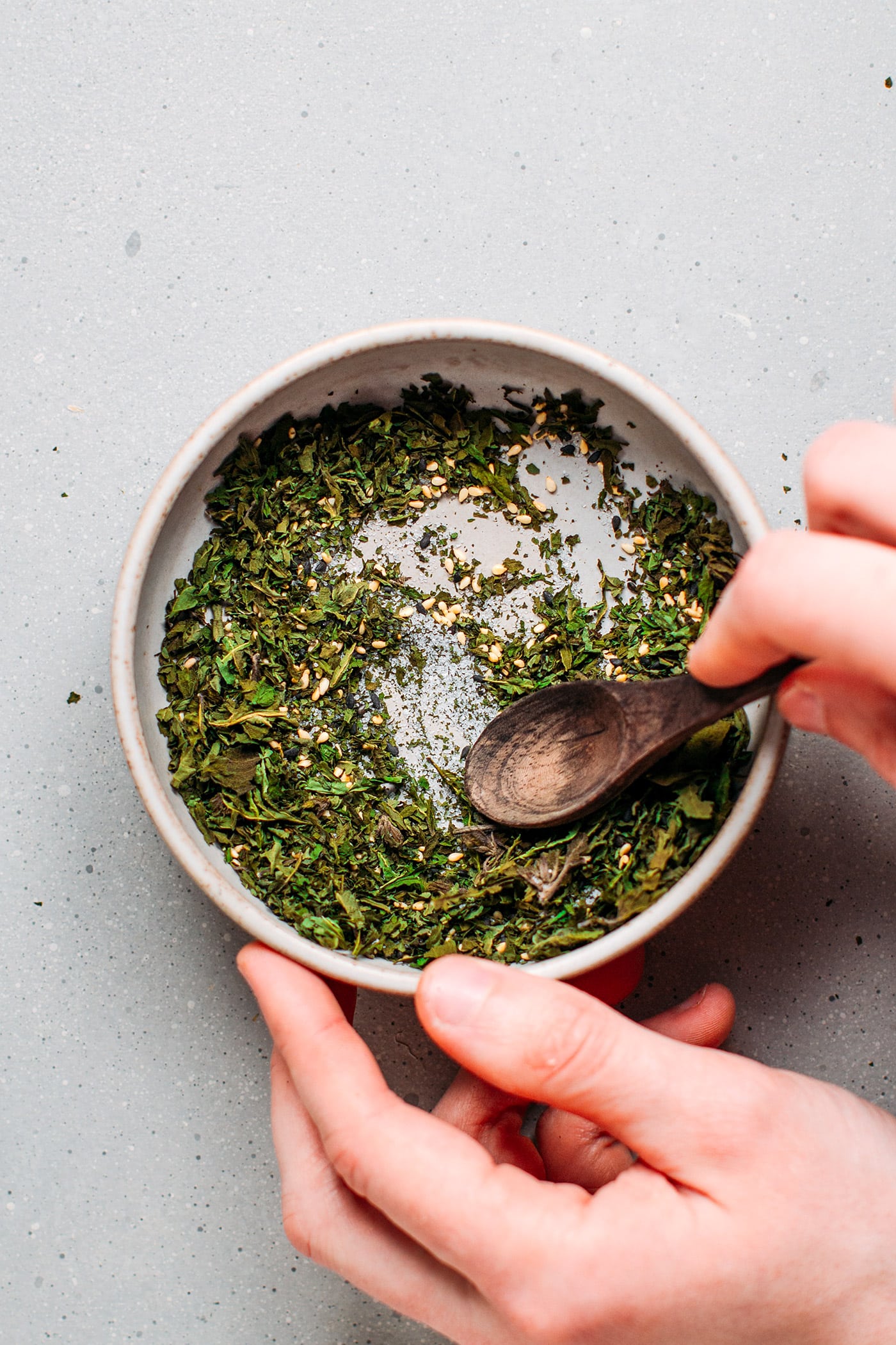 Preparing shiso furikake in a bowl.